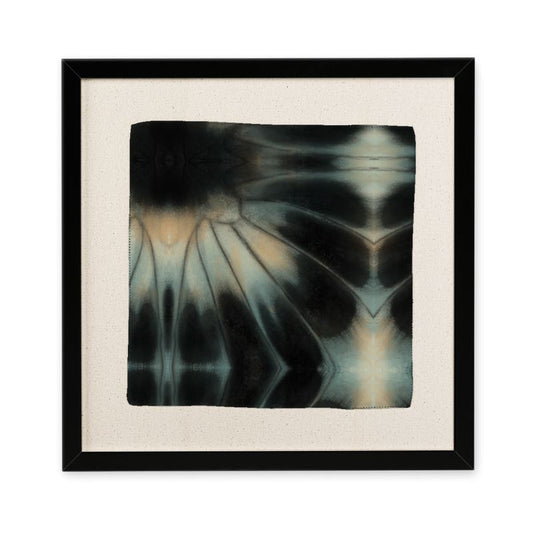 Framed abstract art piece with black, white, and gray patterns on a beige background